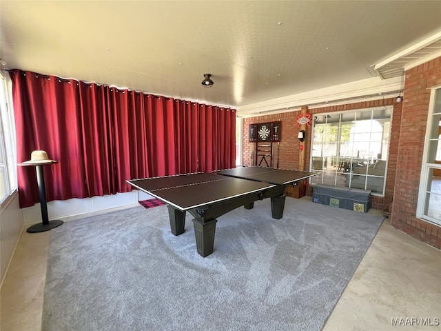playroom with brick wall and carpet floors