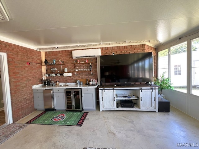 bar with brick wall, wine cooler, an AC wall unit, and indoor wet bar