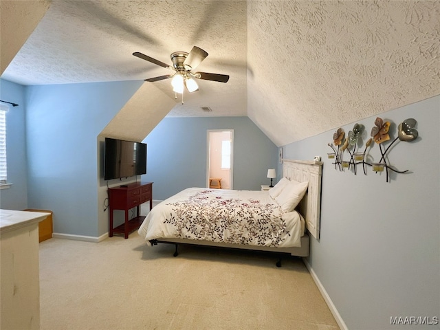 bedroom featuring vaulted ceiling, visible vents, baseboards, a textured ceiling, and carpet flooring