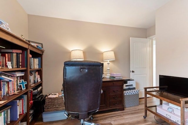 office space with light wood-type flooring