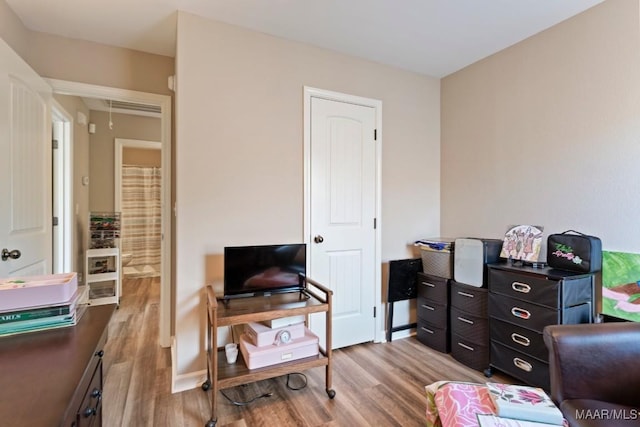office featuring attic access and wood finished floors