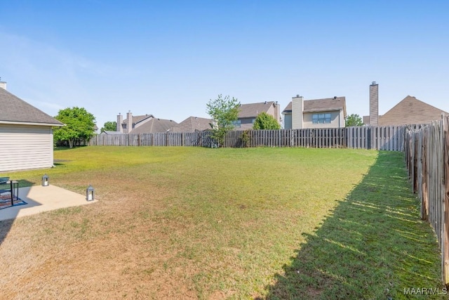 view of yard featuring a fenced backyard and a patio