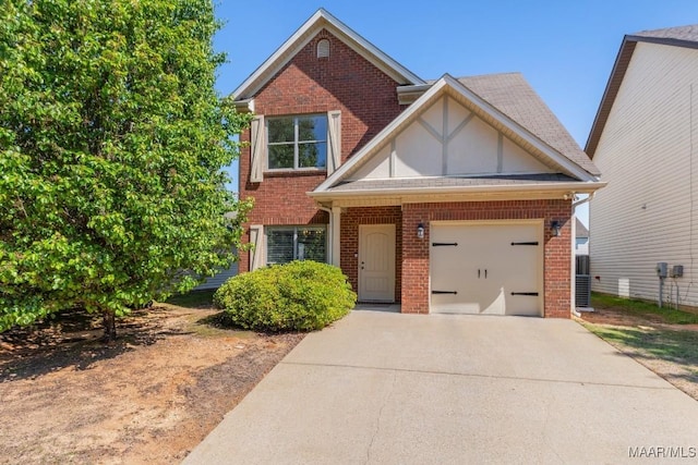 view of front of property featuring brick siding, an attached garage, and concrete driveway