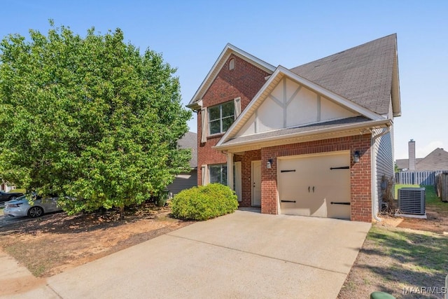 view of front of home with brick siding, an attached garage, driveway, and central AC