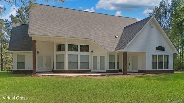 back of house featuring a yard, french doors, and roof with shingles