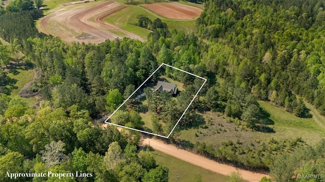 bird's eye view featuring a forest view