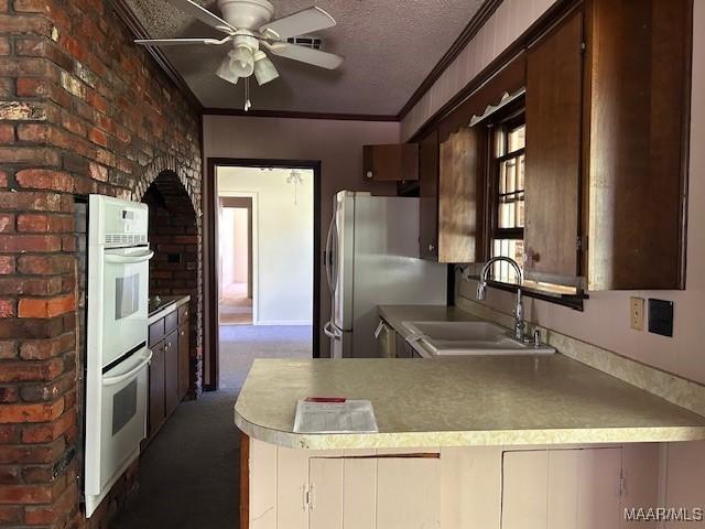 2075 County Road 27, Selma, AL 36701 - kitchen featuring a ceiling fan, a sink, a textured ceiling, double oven, and freestanding refrigerator