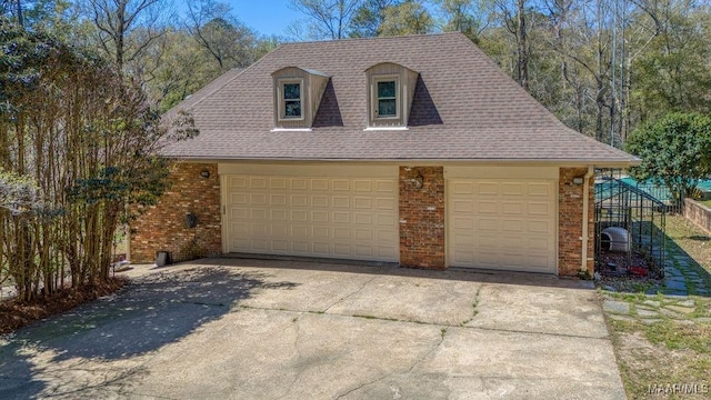 garage featuring driveway