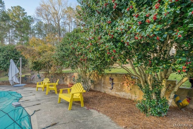 view of patio / terrace featuring fence