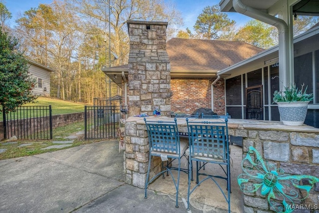 view of patio featuring fence