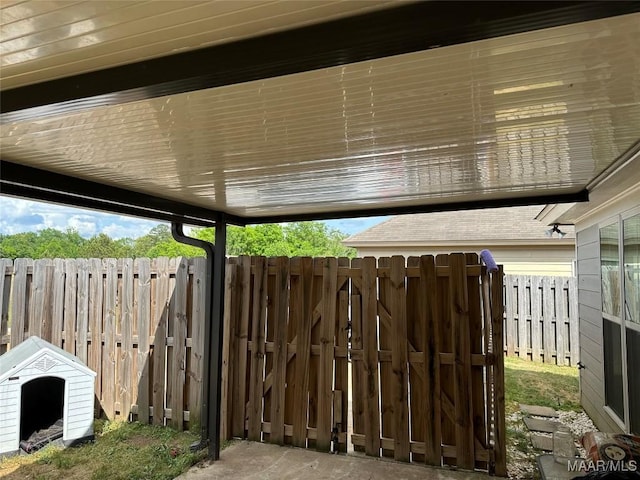 exterior space with fence and a gate
