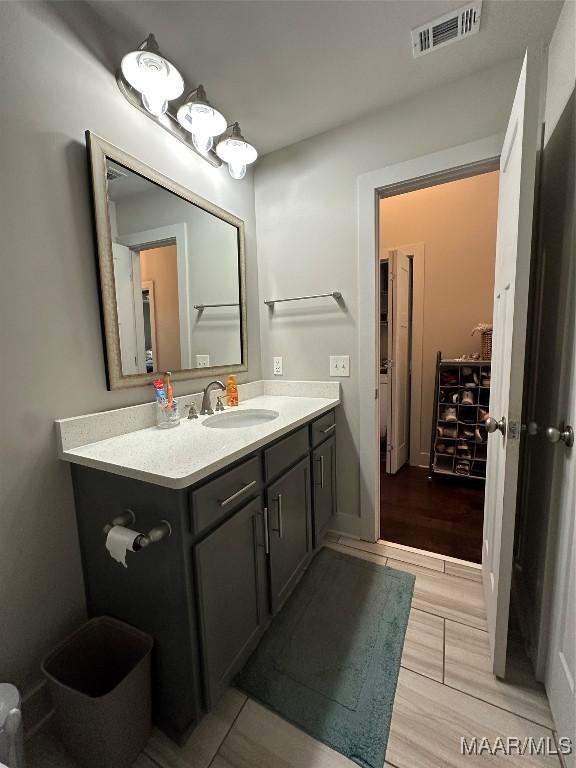 bathroom with visible vents and vanity