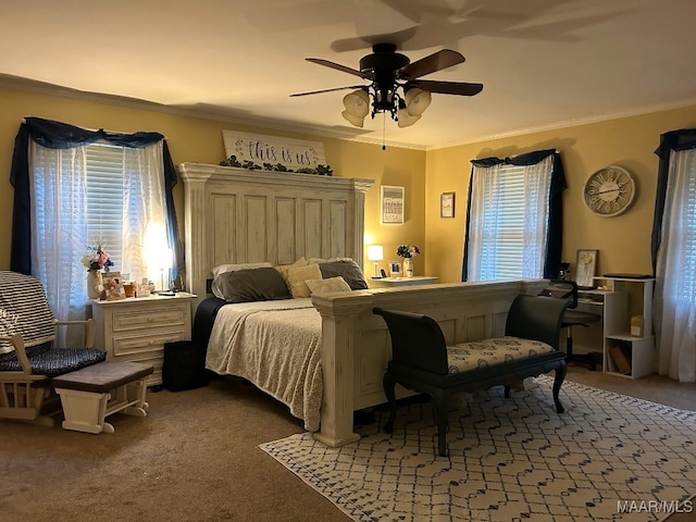 carpeted bedroom with a ceiling fan and ornamental molding