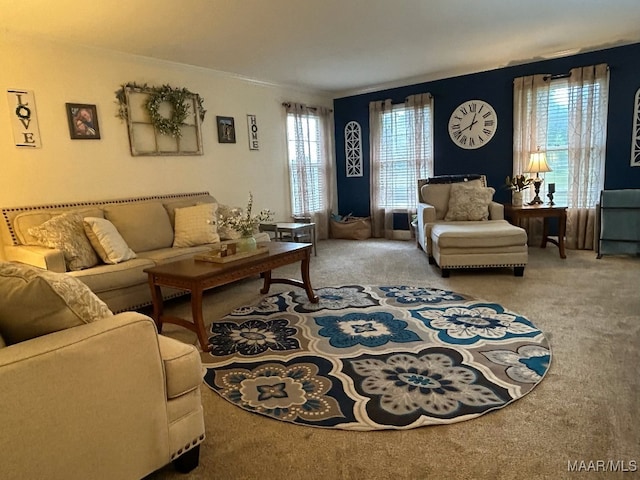 carpeted living room with ornamental molding