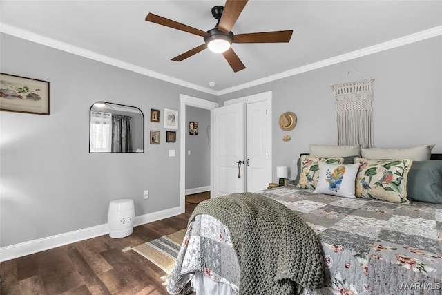 bedroom featuring wood finished floors, a ceiling fan, baseboards, and ornamental molding