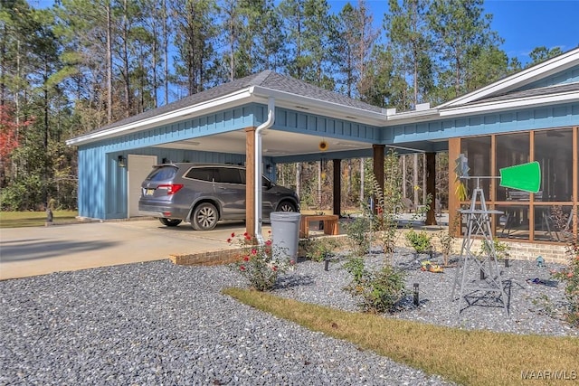 view of parking / parking lot featuring driveway and a carport