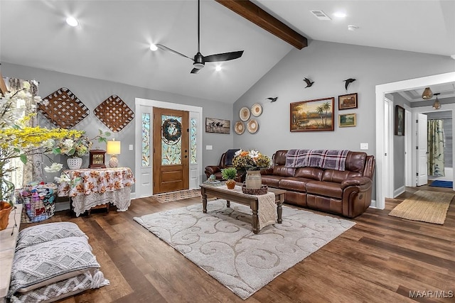 living area featuring beam ceiling, visible vents, a ceiling fan, wood finished floors, and high vaulted ceiling