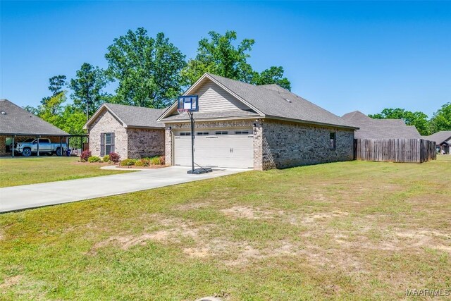 1017 Ridge Point Dr, Deatsville, AL 36022 - view of front of property featuring fence, a front lawn, an attached garage, driveway, and brick siding