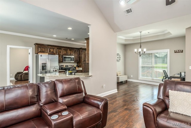 1017 Ridge Point Dr, Deatsville, AL 36022 - living room featuring dark wood-style flooring, visible vents, crown molding, and a notable chandelier