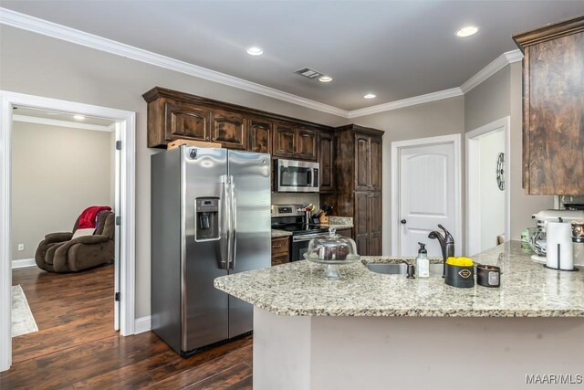 1017 Ridge Point Dr, Deatsville, AL 36022 - kitchen featuring ornamental molding, a peninsula, dark brown cabinetry, and stainless steel appliances