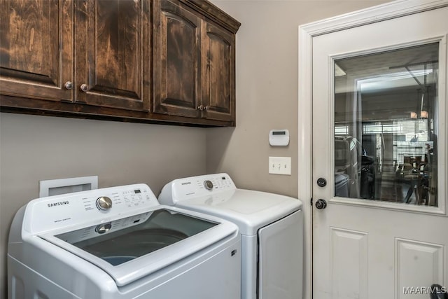 1017 Ridge Point Dr, Deatsville, AL 36022 - laundry area featuring independent washer and dryer and cabinet space