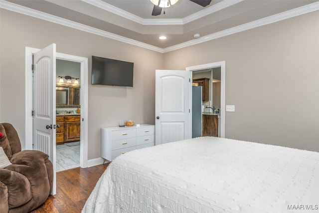 1017 Ridge Point Dr, Deatsville, AL 36022 - bedroom featuring recessed lighting, a raised ceiling, ornamental molding, freestanding refrigerator, and dark wood-style flooring