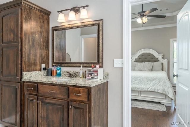 1017 Ridge Point Dr, Deatsville, AL 36022 - ensuite bathroom with wood finished floors, visible vents, a ceiling fan, crown molding, and ensuite bathroom