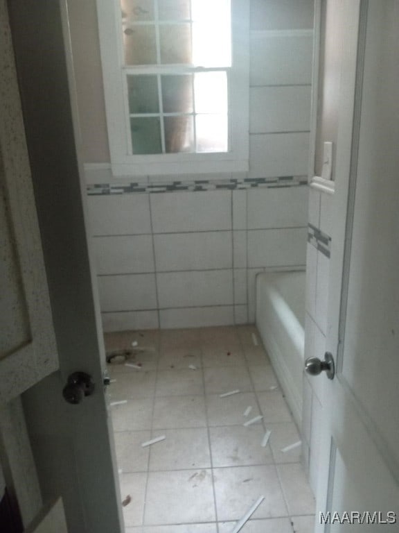 12 E Fairview Ave, Montgomery, AL 36105 - full bathroom with walk in shower, a bath, tile patterned flooring, and tile walls