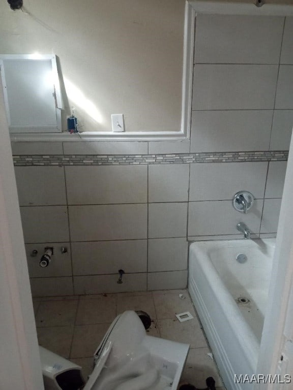 12 E Fairview Ave, Montgomery, AL 36105 - bathroom with tile walls and tile patterned floors
