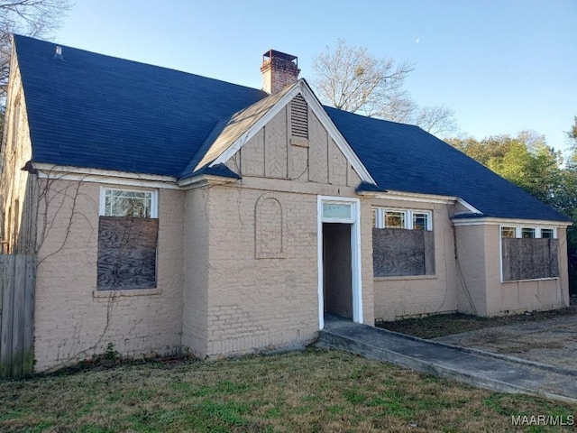 12 E Fairview Ave, Montgomery, AL 36105 - view of front of property featuring a shingled roof and a chimney