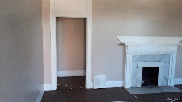 12 E Fairview Ave, Montgomery, AL 36105 - details with a tiled fireplace, visible vents, and baseboards