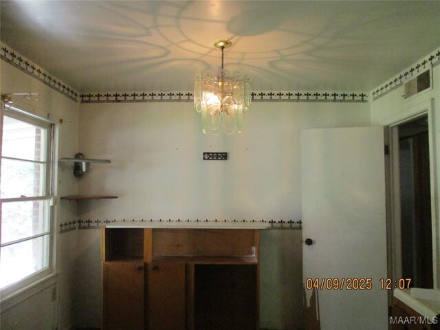 interior space featuring a chandelier and plenty of natural light