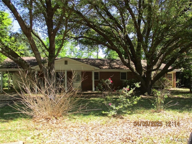 ranch-style house with brick siding