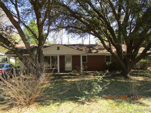 ranch-style home with brick siding