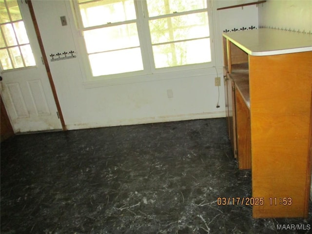 unfurnished room featuring a healthy amount of sunlight