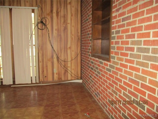 interior space featuring wooden walls