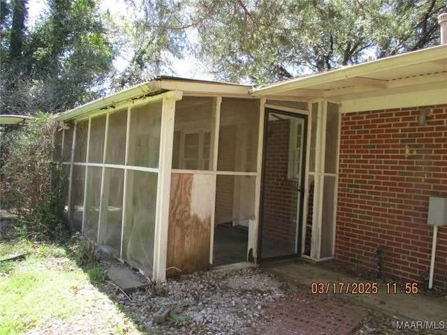 exterior space with brick siding