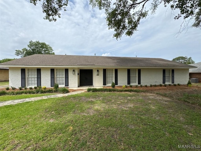 single story home featuring a front yard, central air condition unit, and brick siding