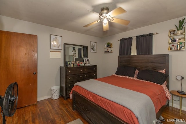 bedroom with wood finished floors, ceiling fan, and baseboards