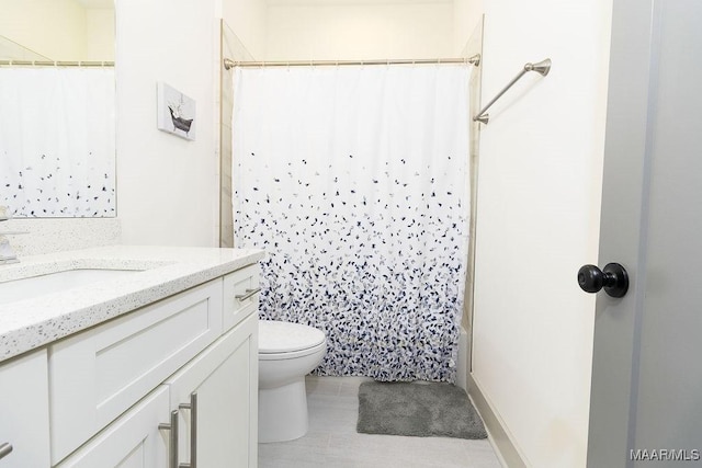 bathroom with toilet, vanity, a shower with curtain, and tile patterned flooring