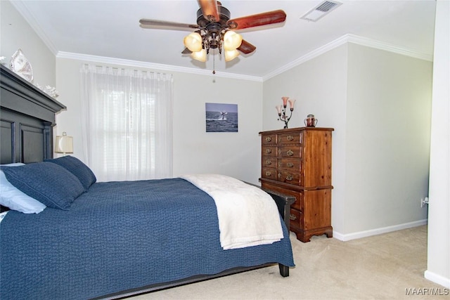 bedroom with visible vents, crown molding, baseboards, and carpet floors
