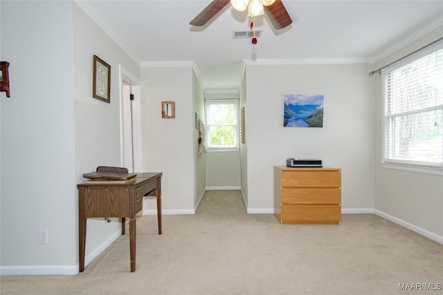 interior space featuring ceiling fan, crown molding, visible vents, light carpet, and baseboards