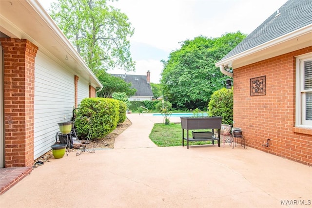 view of patio / terrace with an outdoor pool