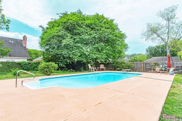 view of pool with a fenced backyard, a patio, and a fenced in pool