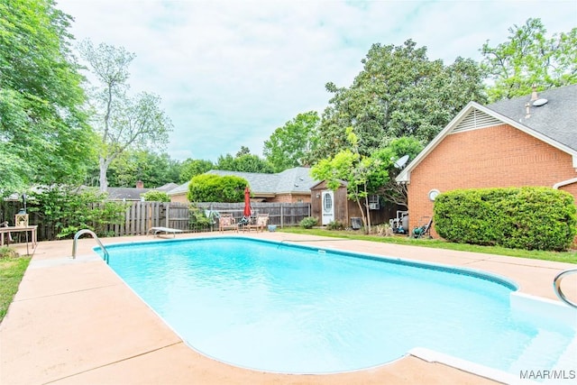 view of swimming pool with fence and a fenced in pool