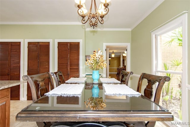 dining room featuring an inviting chandelier and crown molding