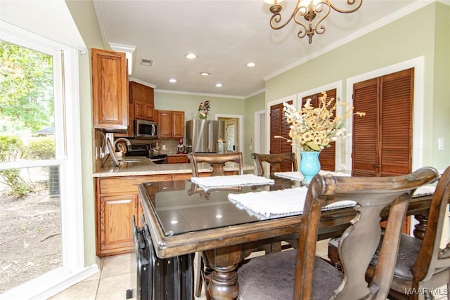 dining area featuring light tile patterned floors, visible vents, an inviting chandelier, recessed lighting, and ornamental molding
