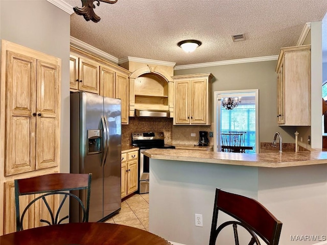 kitchen featuring stainless steel appliances, backsplash, visible vents, a peninsula, and light tile patterned flooring