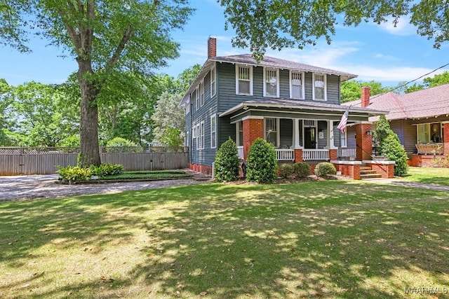 48 S Capitol Pkwy, Montgomery, AL 36107 - american foursquare style home featuring fence, a chimney, covered porch, and a front lawn