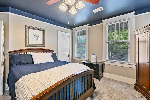 48 S Capitol Pkwy, Montgomery, AL 36107 - bedroom with baseboards, visible vents, light carpet, and ceiling fan